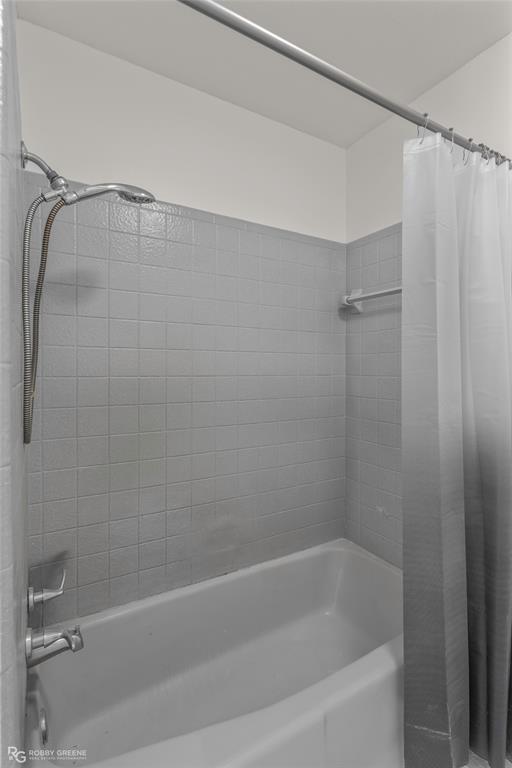 1303 Young Road Benton, LA 71006 - Photo 25 of 34 Bathroom with shower / bath combo with shower curtain
