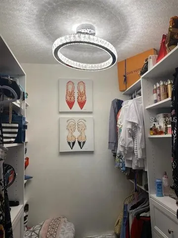 a bathroom with a refrigerator and a sink