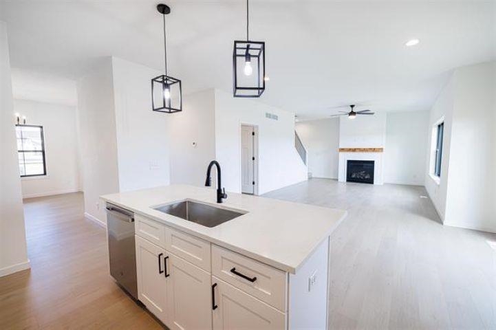 14192 Prairie Commons Lane South Beloit, IL 61080 - Photo 11 of 29 a kitchen with a sink and chandelier