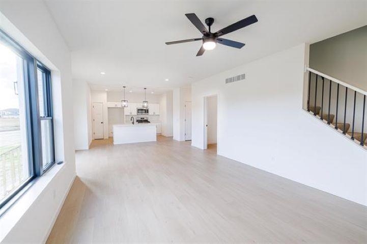 14192 Prairie Commons Lane South Beloit, IL 61080 - Photo 16 of 29 a view of a livingroom with a ceiling fan