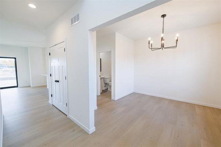 14192 Prairie Commons Lane South Beloit, IL 61080 - Photo 4 of 29 wooden floor in an empty room with a window