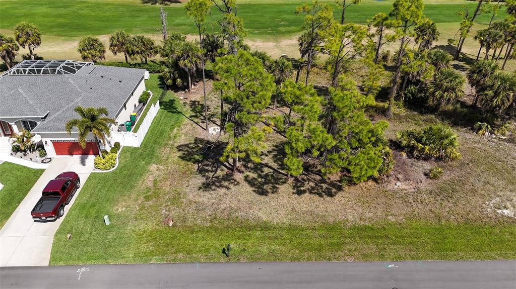 242 Marker Road Rotonda West, FL 33947 - Photo 3 of 9 an aerial view of a house with a yard basket ball court