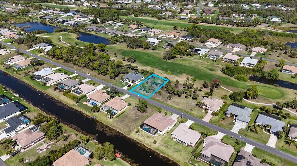 242 Marker Road Rotonda West, FL 33947 - Photo 4 of 9 an aerial view of a city with lots of residential buildings