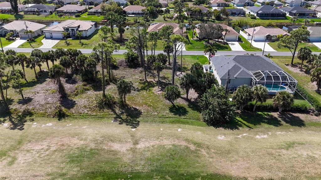 242 Marker Road Rotonda West, FL 33947 - Photo 7 of 9 an aerial view of residential houses with outdoor space and trees