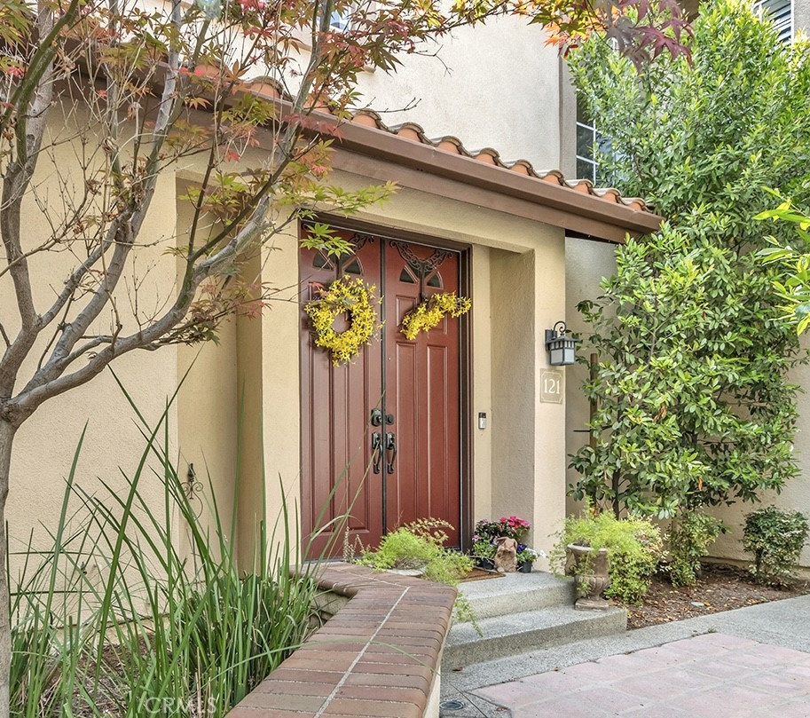 121 Pasto Rico Rancho Santa Margarita, CA 92688 - Photo 1 of 1 a front view of a house with a yard