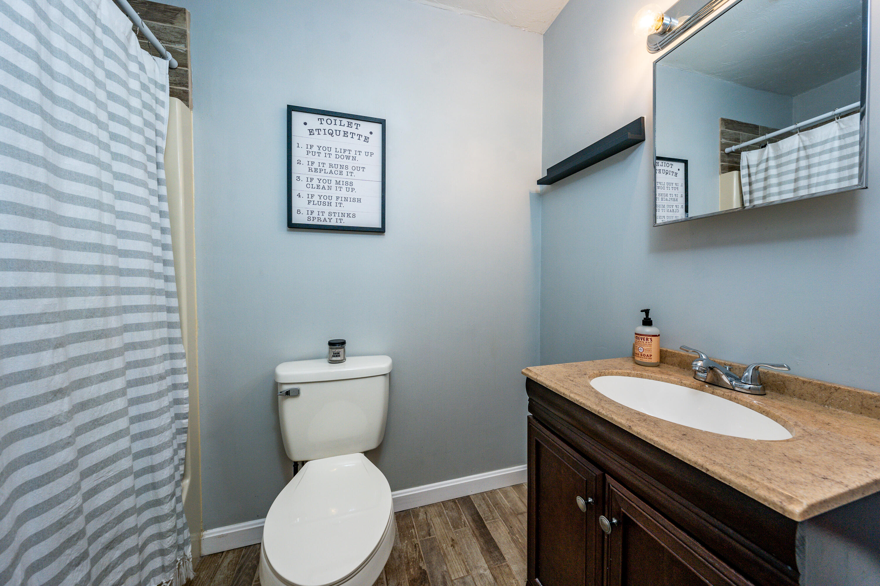 5 Tremont Center Road West Wareham, MA 02576 - Photo 15 of 17 a bathroom with a granite countertop toilet sink and mirror