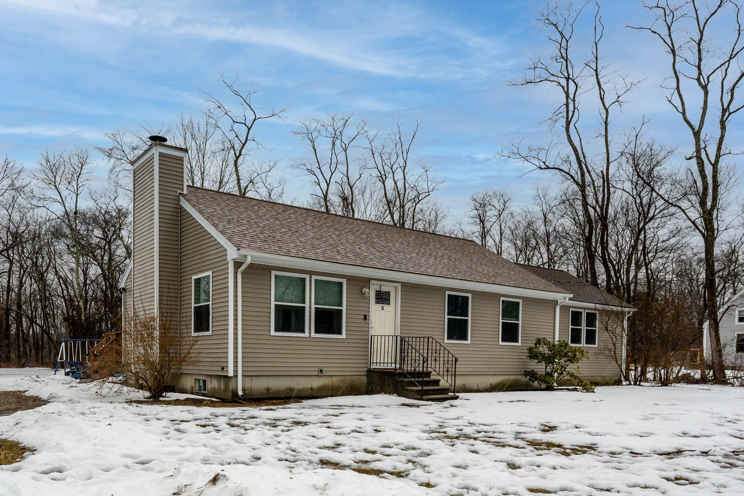 5 Tremont Center Road West Wareham, MA 02576 - Photo 2 of 17 a front view of a house with a yard covered in snow