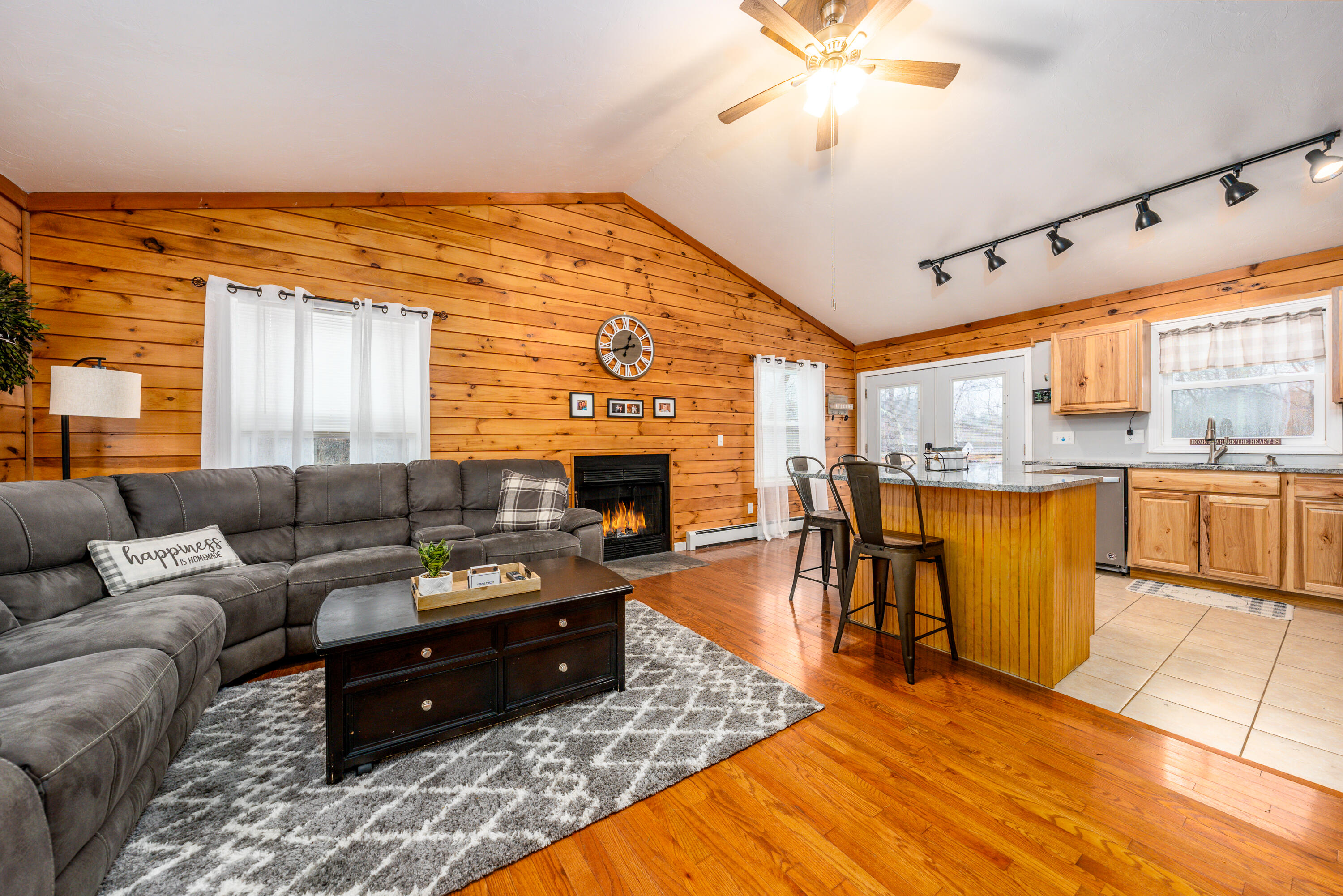5 Tremont Center Road West Wareham, MA 02576 - Photo 4 of 17 a living room with furniture a fireplace and kitchen view