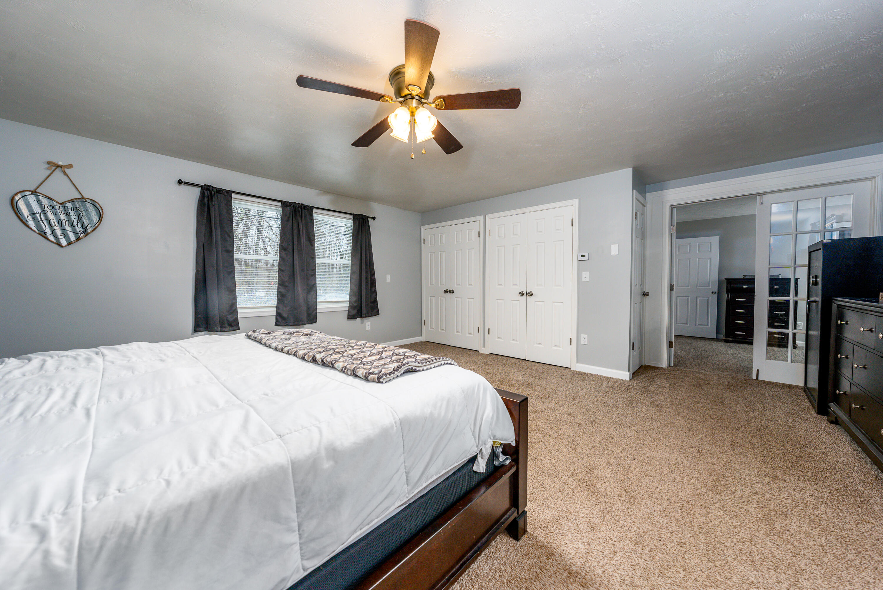 5 Tremont Center Road West Wareham, MA 02576 - Photo 9 of 17 a spacious bedroom with a bed and a chandelier
