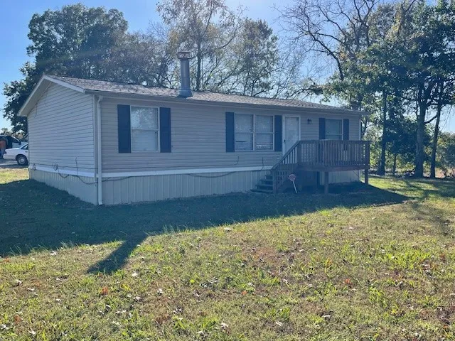 a front view of house with a yard