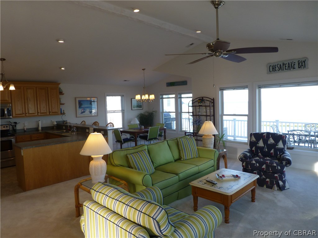 8 Chesapeake Shore Road Port Haywood, VA 23138 - Photo 6 of 26 Living Room, Dining Room & Kitchen - open, bright, the best of beach living!