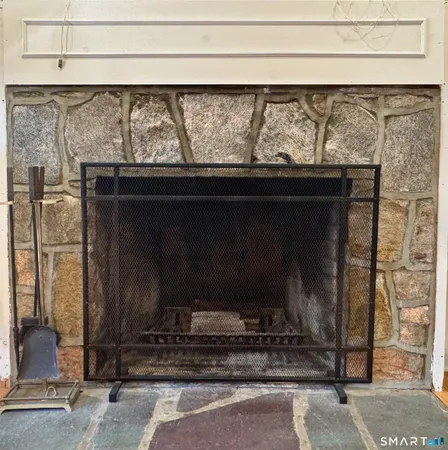 a closeup of a fireplace with a wooden floor