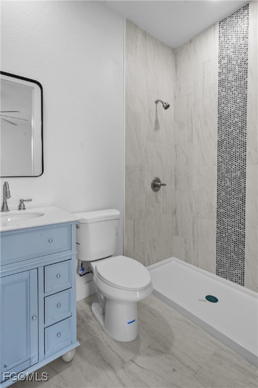 634 Knapp Street Lehigh Acres, FL 33974 - Photo 16 of 29 a bathroom with a sink a toilet and shower