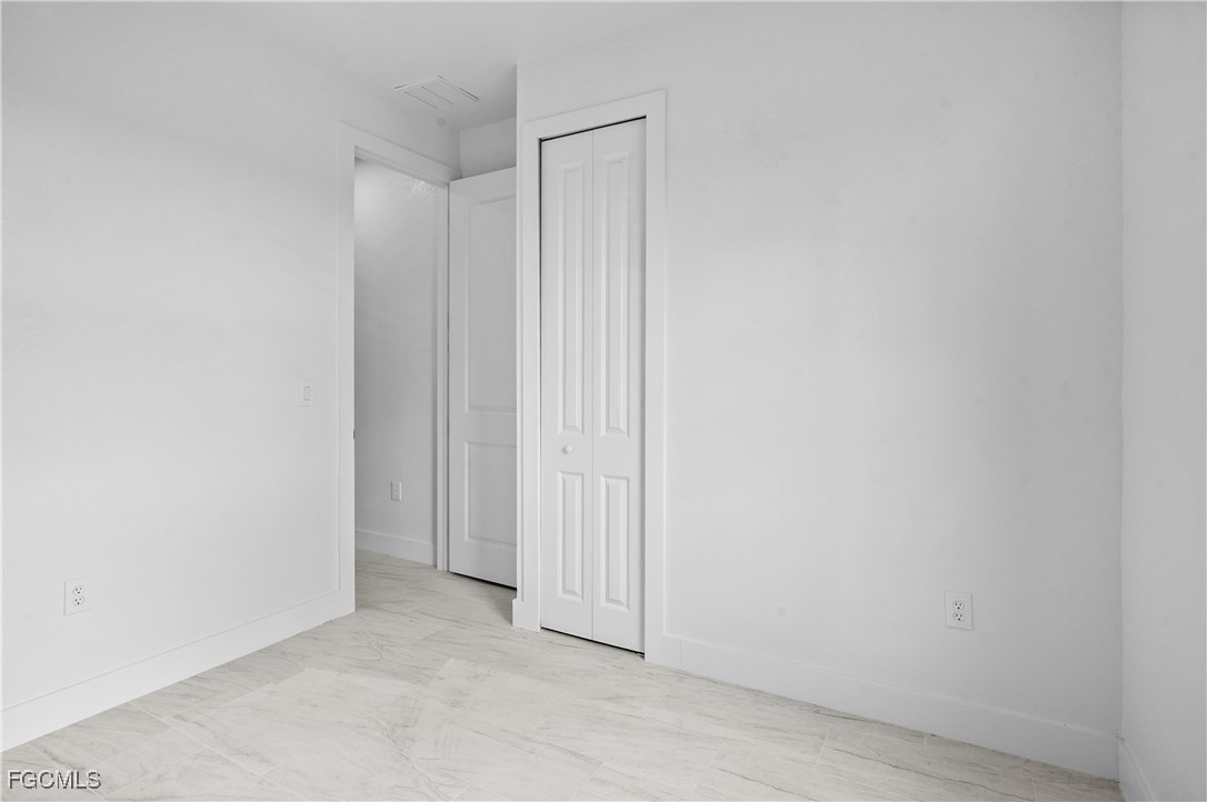 634 Knapp Street Lehigh Acres, FL 33974 - Photo 19 of 29 a view of an empty room