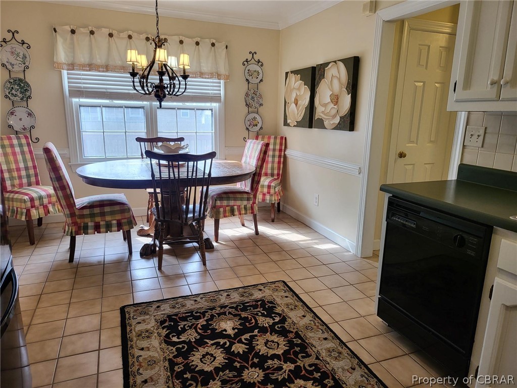 2449 Everglades Road Norfolk, VA 23518 - Photo 17 of 31 a view of a dining room with furniture and chandelier