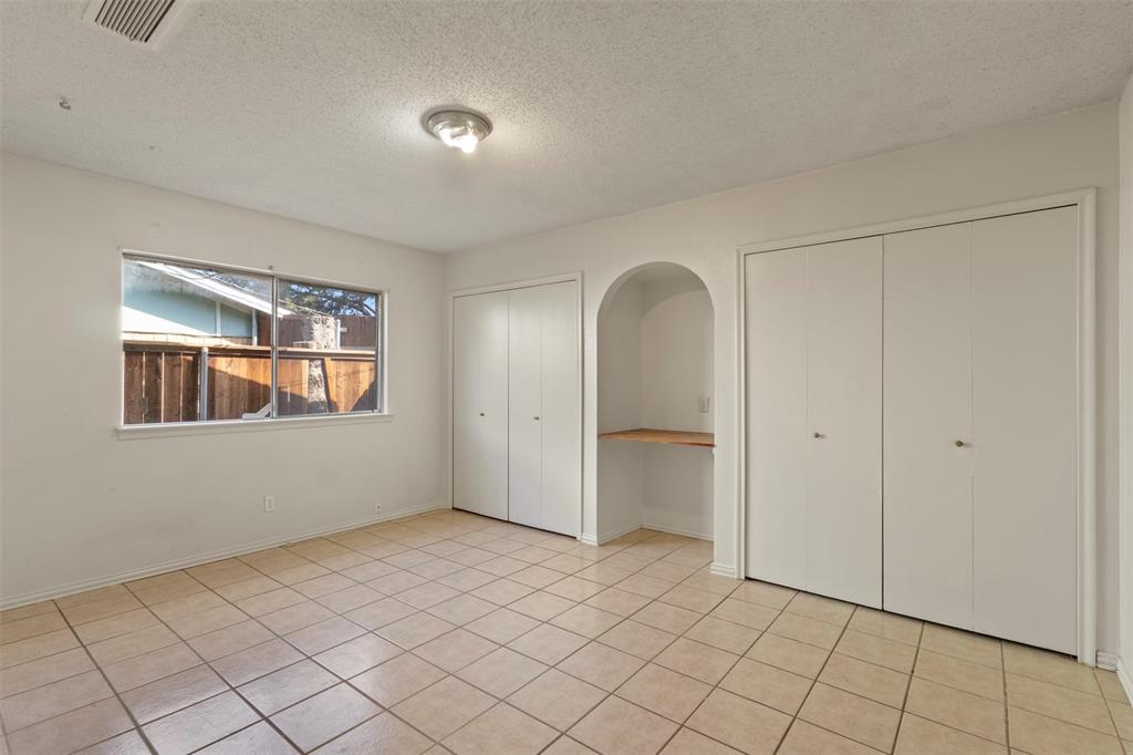 1400 Ridgecrest Drive Plano, TX 75074 - Photo 13 of 32 a view of an empty room and window