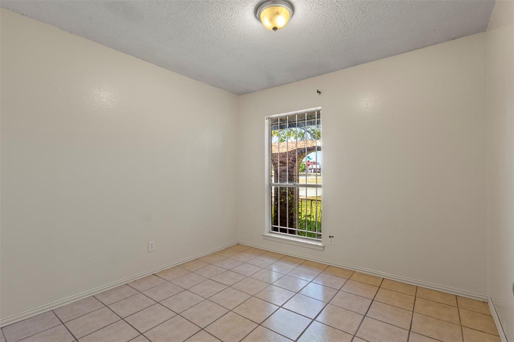 1400 Ridgecrest Drive Plano, TX 75074 - Photo 17 of 32 an empty room with windows