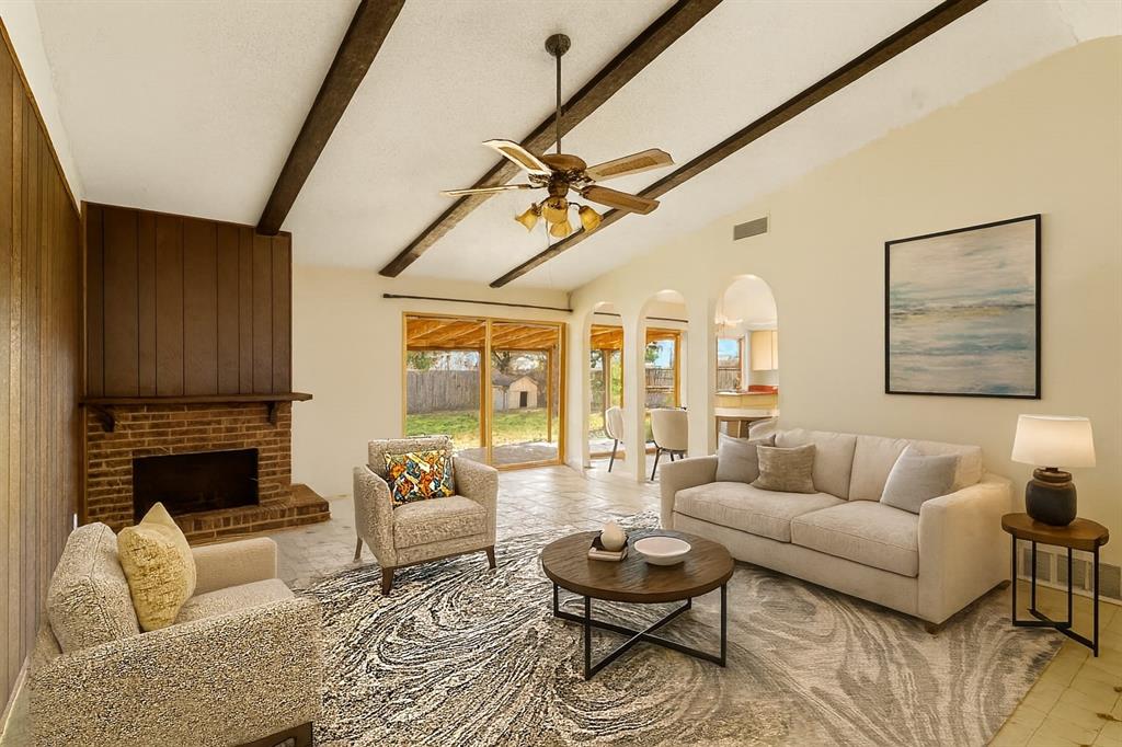 1400 Ridgecrest Drive Plano, TX 75074 - Photo 2 of 32 a living room with furniture or couch and a fireplace