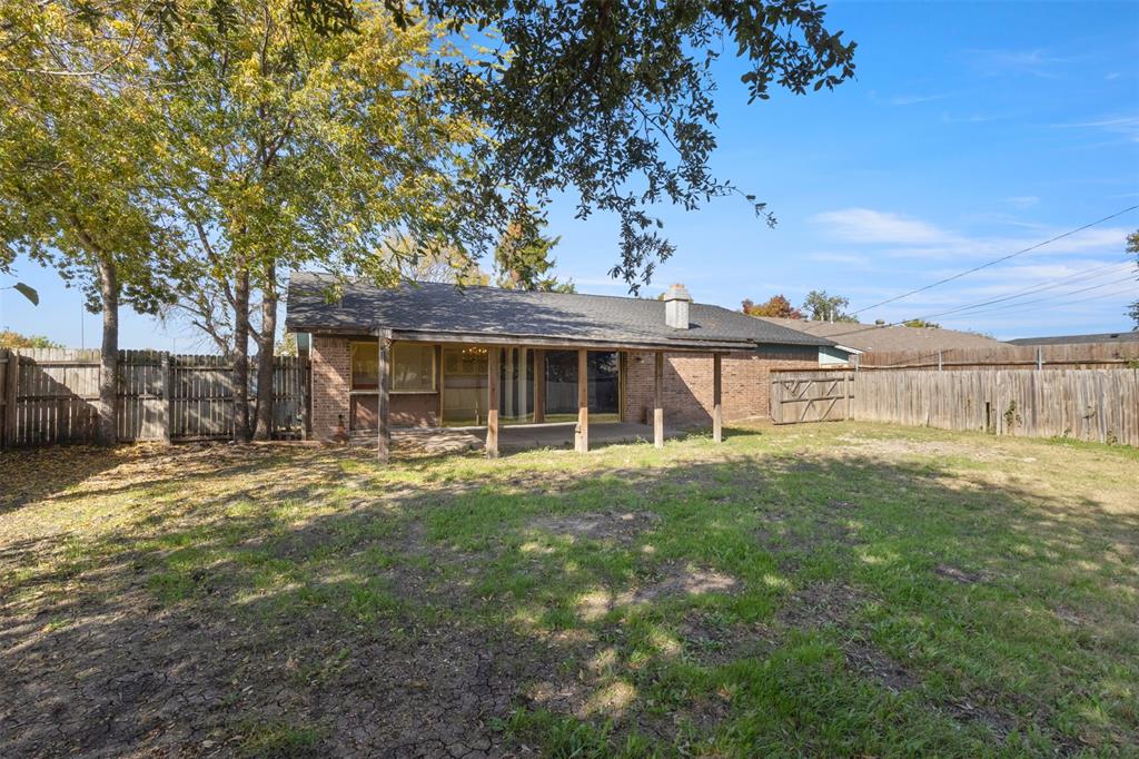 1400 Ridgecrest Drive Plano, TX 75074 - Photo 23 of 32 a view of a house with a yard