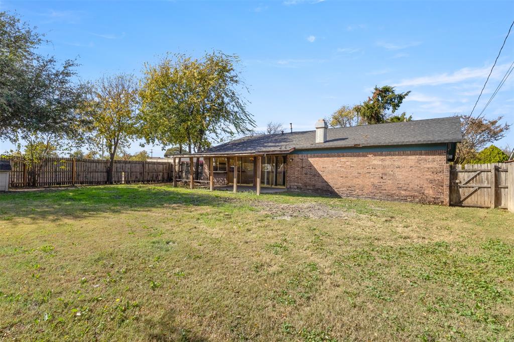 1400 Ridgecrest Drive Plano, TX 75074 - Photo 24 of 32 a front view of a house with garden