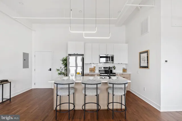 a dining room with furniture and wooden floor