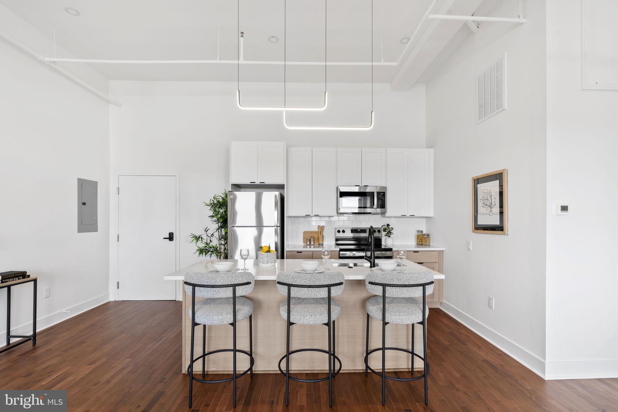 240 Hermitage Street, Unit 202 Philadelphia, PA 19127 - Photo 19 of 23 a dining room with furniture and wooden floor