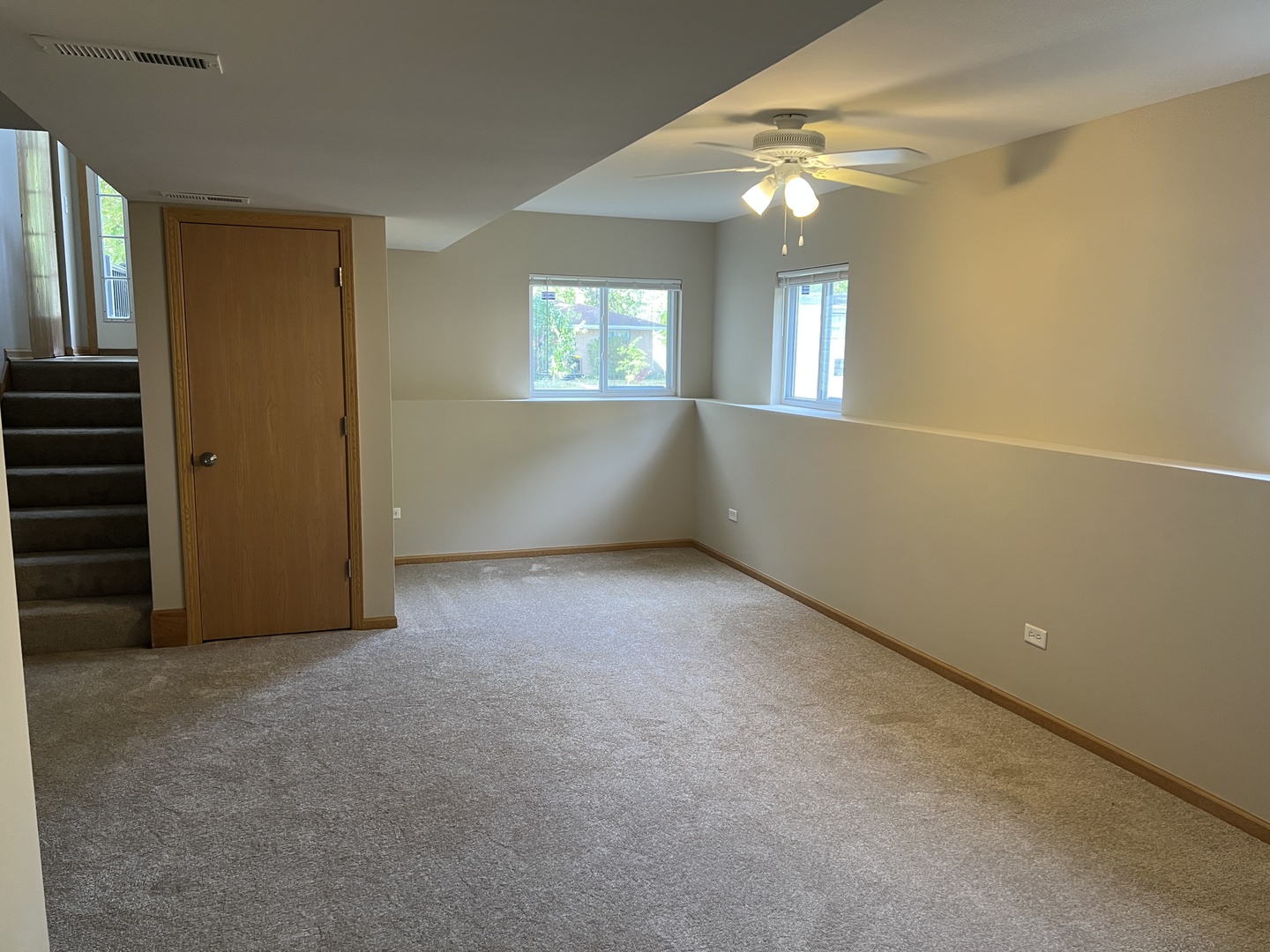 2207 Gabriel Avenue Zion, IL 60099 - Photo 9 of 13 an empty room with windows and fan