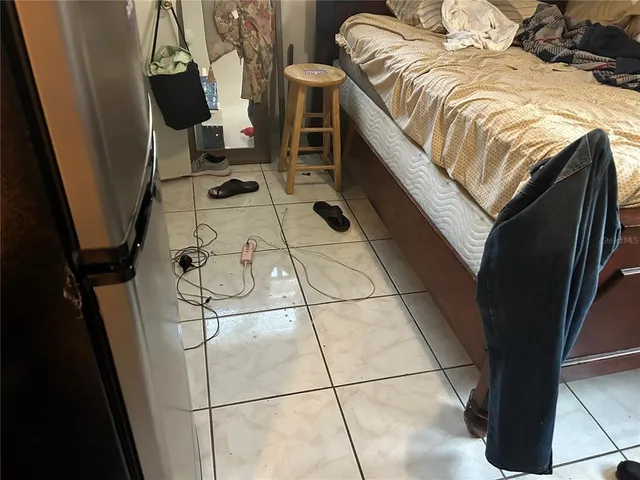 a kitchen with a sink appliances and cabinets