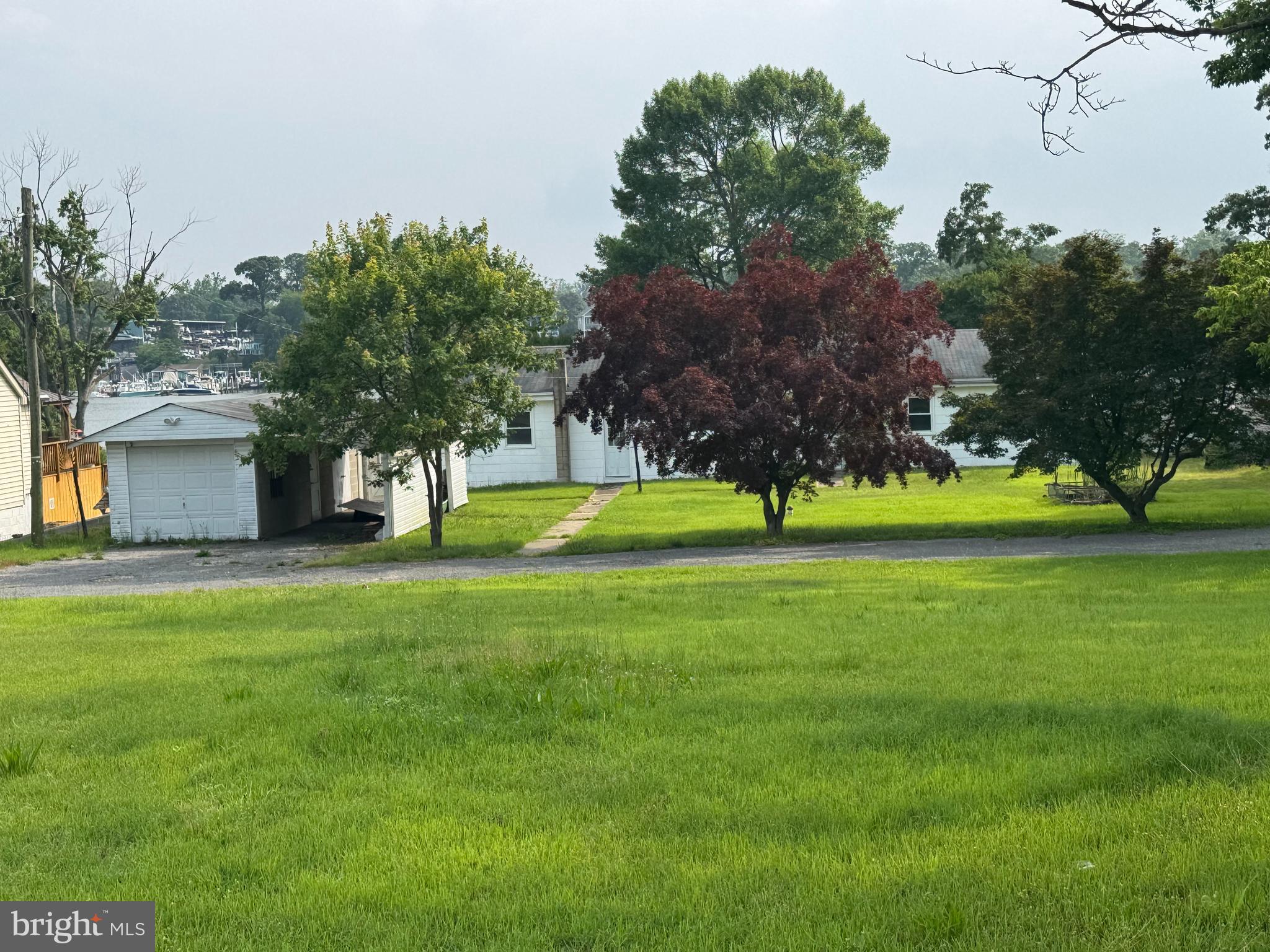 372 Riverside Drive Pasadena, MD 21122 - Photo 15 of 19 a view of a house with a big yard