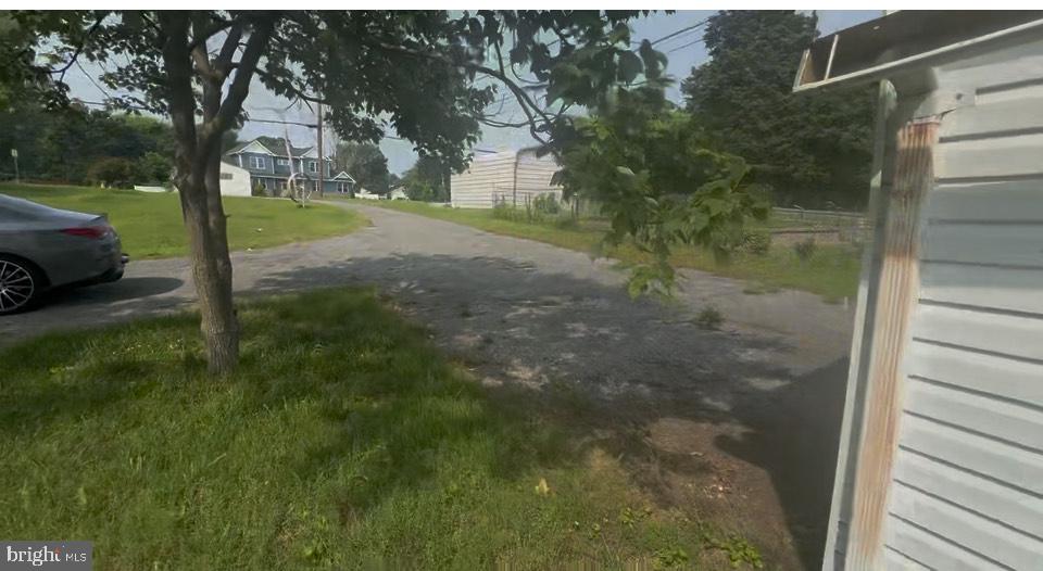 372 Riverside Drive Pasadena, MD 21122 - Photo 16 of 19 a view of a yard with a tree