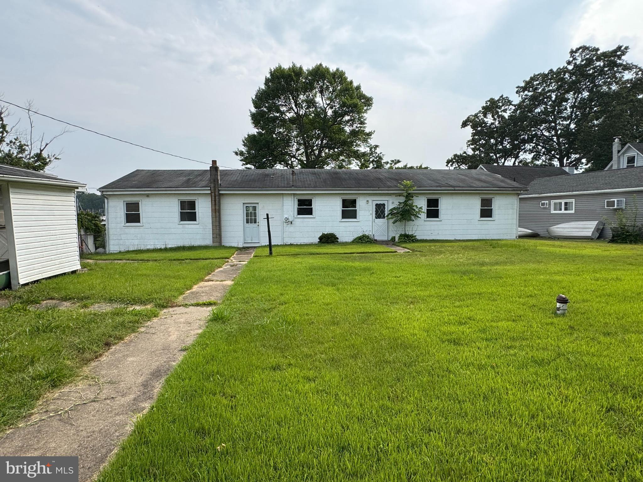 372 Riverside Drive Pasadena, MD 21122 - Photo 17 of 19 a view of a house with a big yard