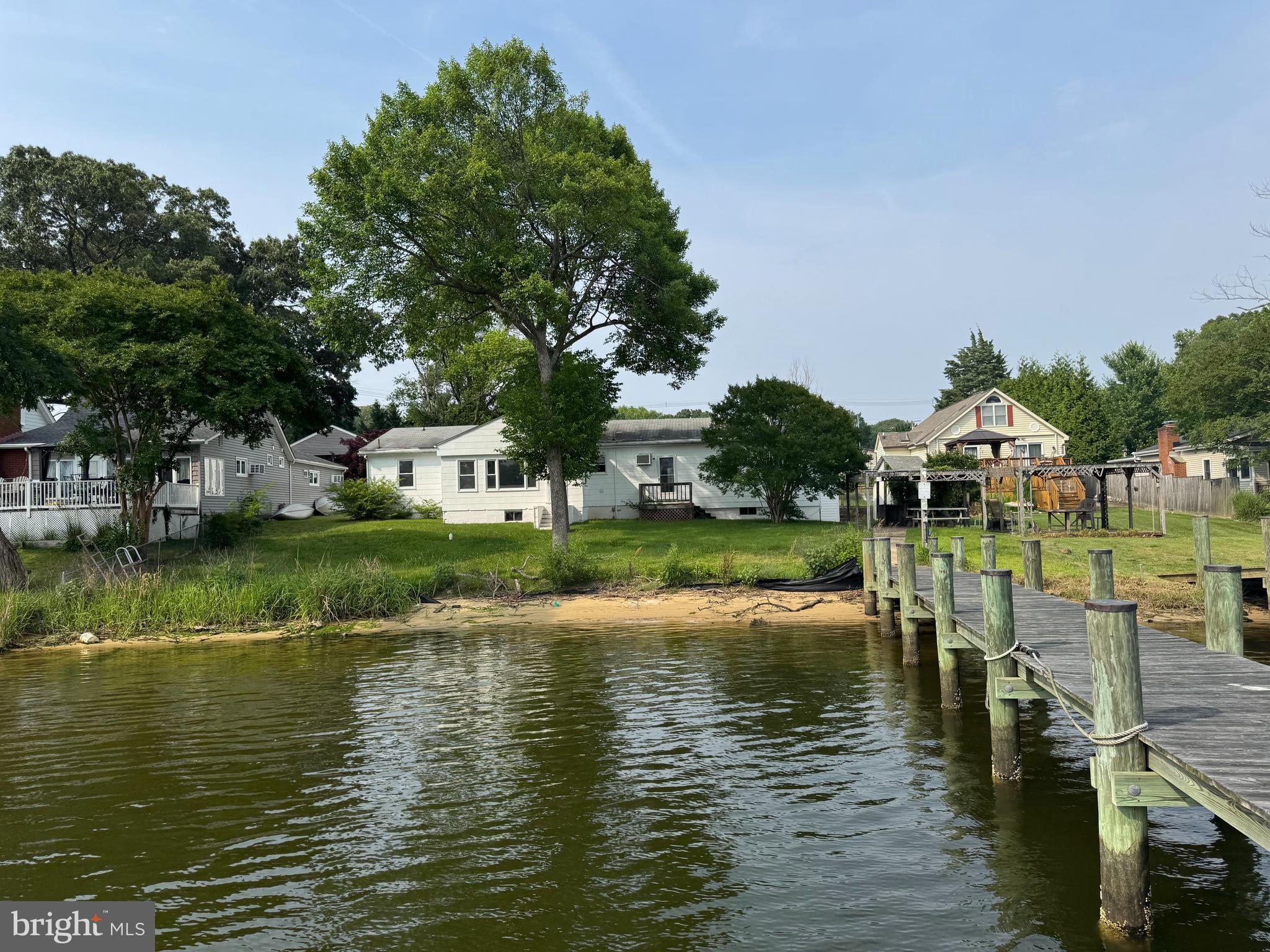 372 Riverside Drive Pasadena, MD 21122 - Photo 2 of 19 a view of a lake with houses