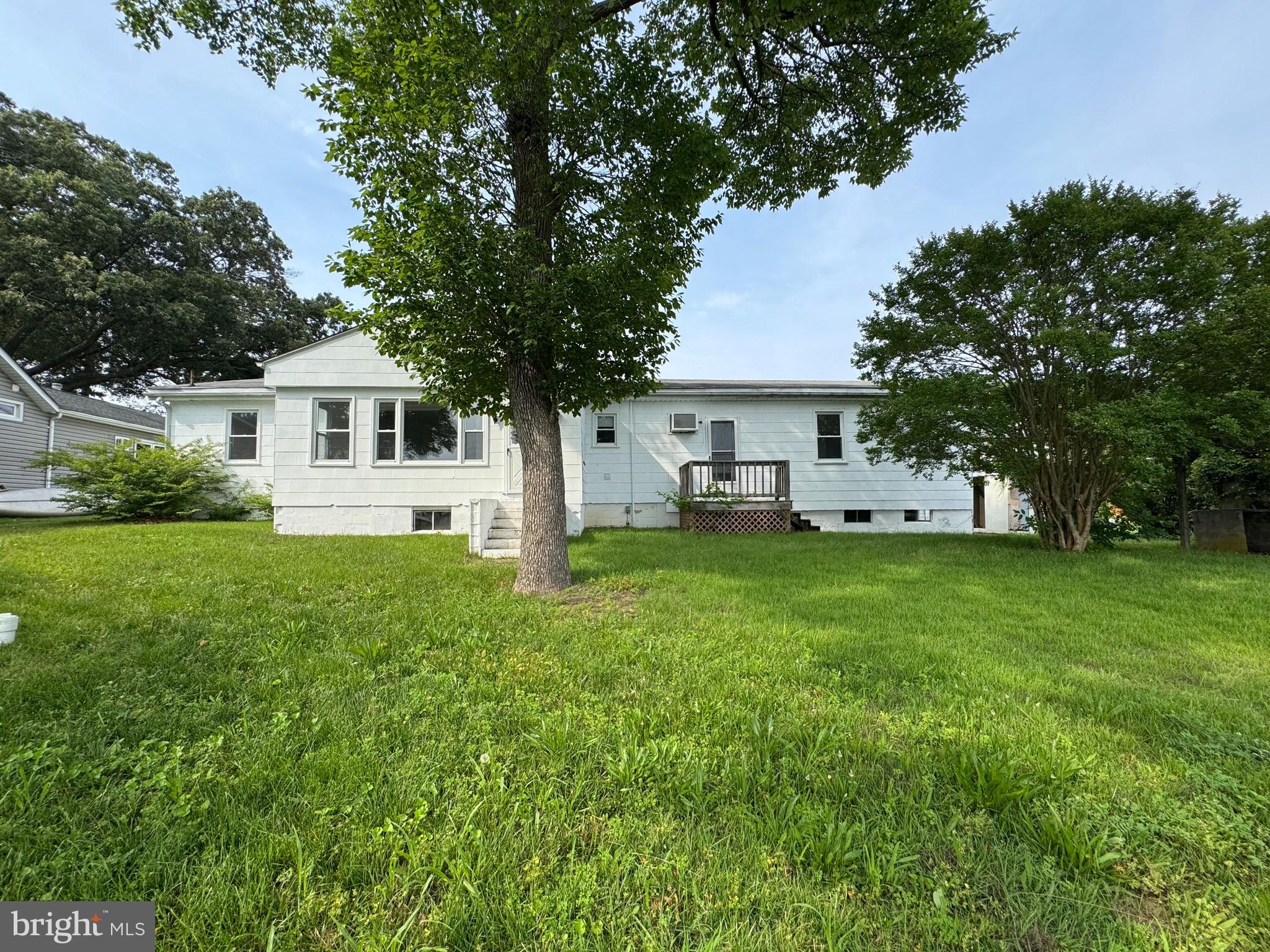 372 Riverside Drive Pasadena, MD 21122 - Photo 5 of 19 a front view of house with yard and green space