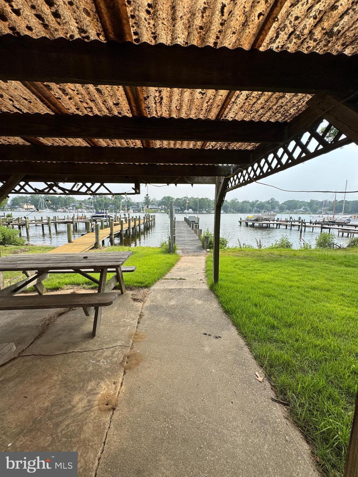 372 Riverside Drive Pasadena, MD 21122 - Photo 6 of 19 a view of a swimming pool with an outdoor seating