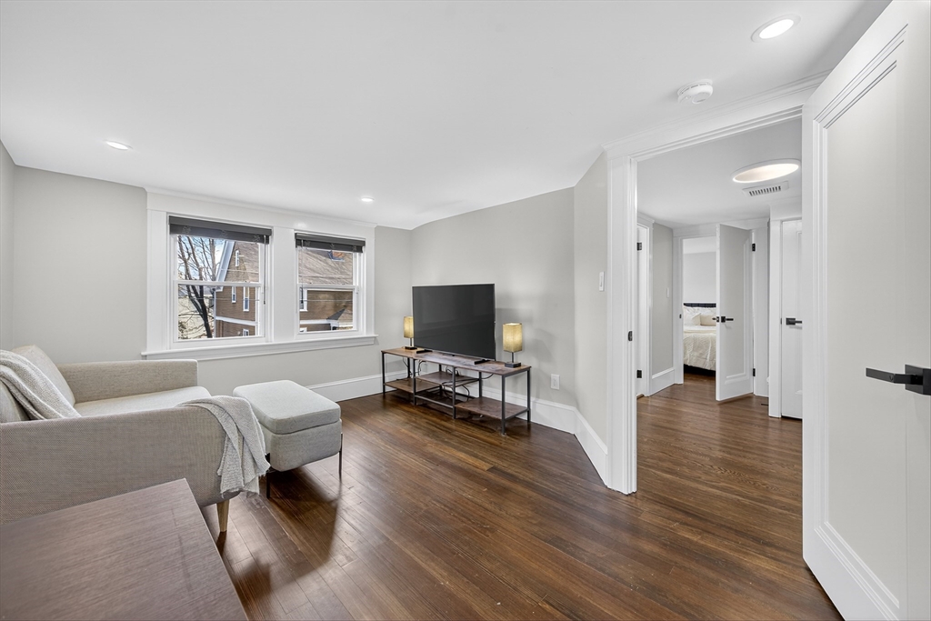 23 R Eddy Street North Attleboro, MA 02760 - Photo 21 of 29 a living room with furniture and a flat screen tv