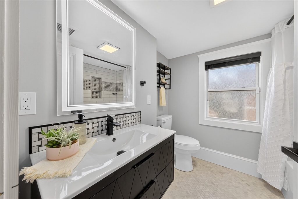 23 R Eddy Street North Attleboro, MA 02760 - Photo 22 of 29 a bathroom with a sink and a mirror