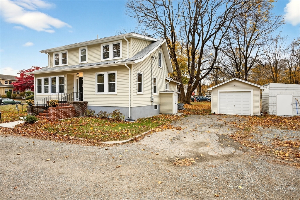 23 R Eddy Street North Attleboro, MA 02760 - Photo 27 of 29 a front view of a house with a yard