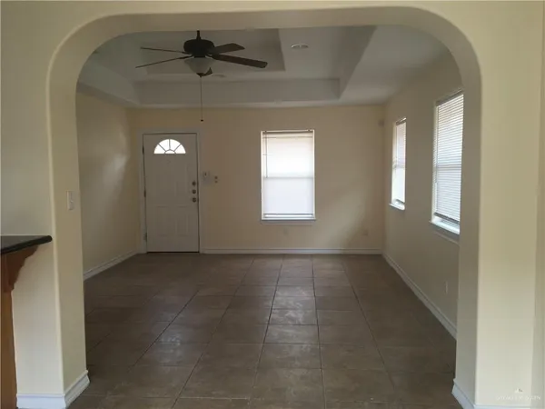 an empty room that has a window in it