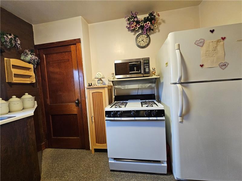 418 Saxonburg Road Butler, PA 16002 - Photo 15 of 27 a kitchen with a refrigerator and a stove