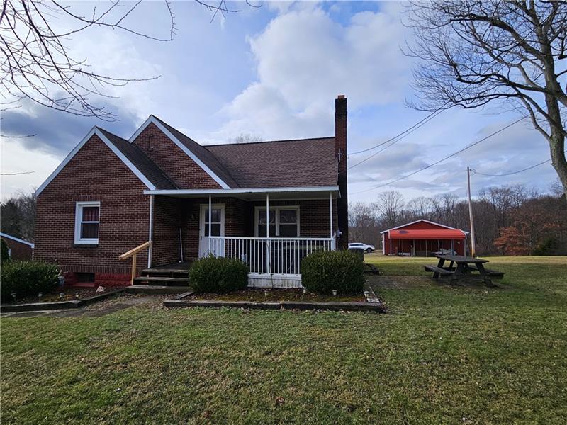 418 Saxonburg Road Butler, PA 16002 - Photo 23 of 27 a front view of a house with garden