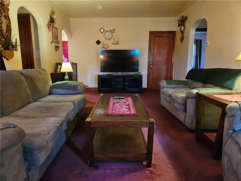 418 Saxonburg Road Butler, PA 16002 - Photo 5 of 27 a living room with furniture and a flat screen tv