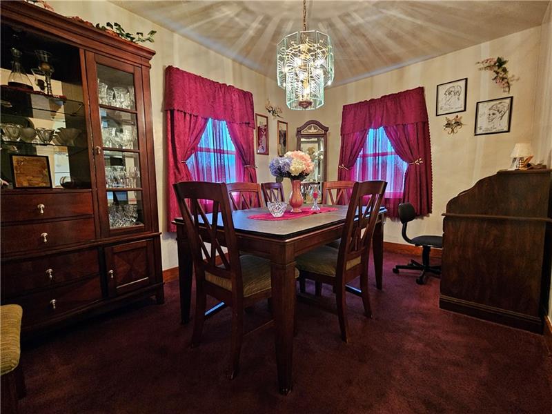 418 Saxonburg Road Butler, PA 16002 - Photo 8 of 27 a view of a dining room with furniture and chandelier