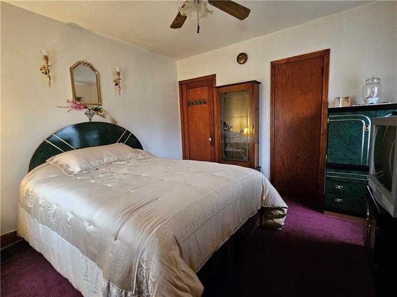 418 Saxonburg Road Butler, PA 16002 - Photo 9 of 27 a bedroom with a bed and a walk in closet