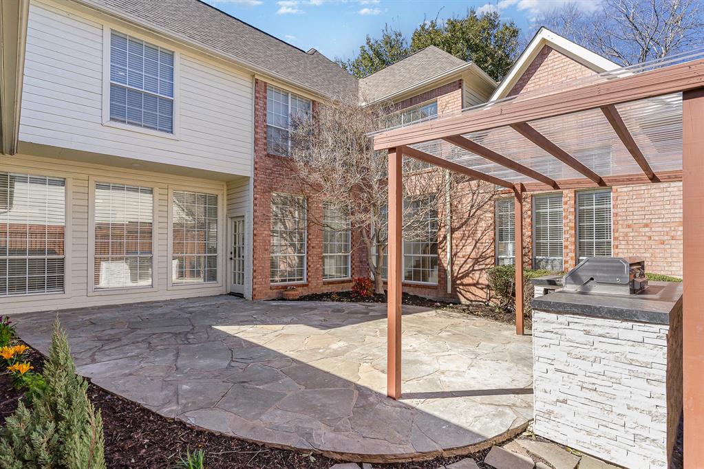 7524 Aberdon Road Dallas, TX 75252 - Photo 28 of 39 View of patio / terrace featuring an outdoor kitchen