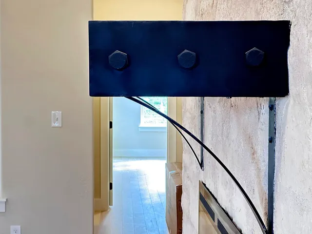 a large kitchen with stainless steel appliances a large counter top a stove and a sink