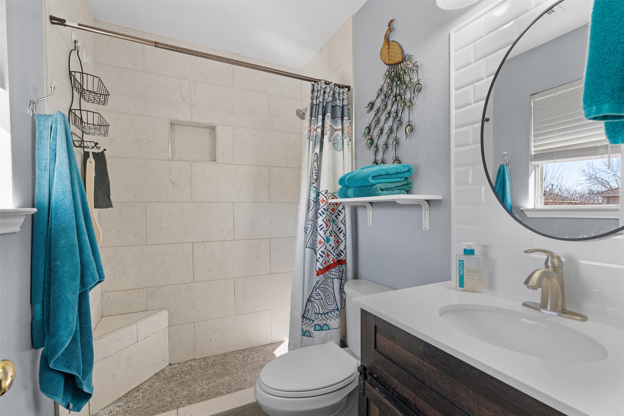 128 Steven Street Hutto, TX 78634 - Photo 14 of 29 a bathroom with a sink a toilet and shower