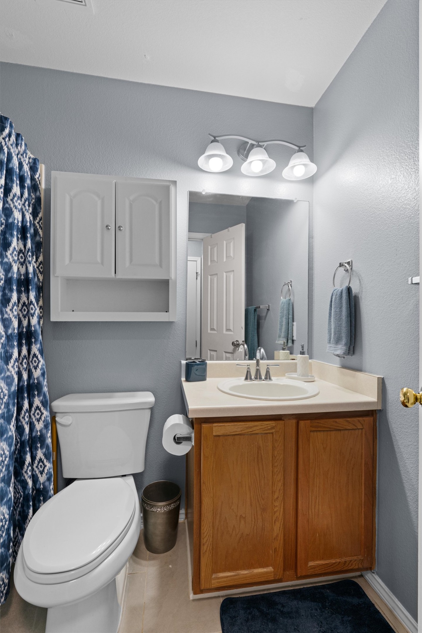 128 Steven Street Hutto, TX 78634 - Photo 20 of 29 a bathroom with a toilet sink and mirror