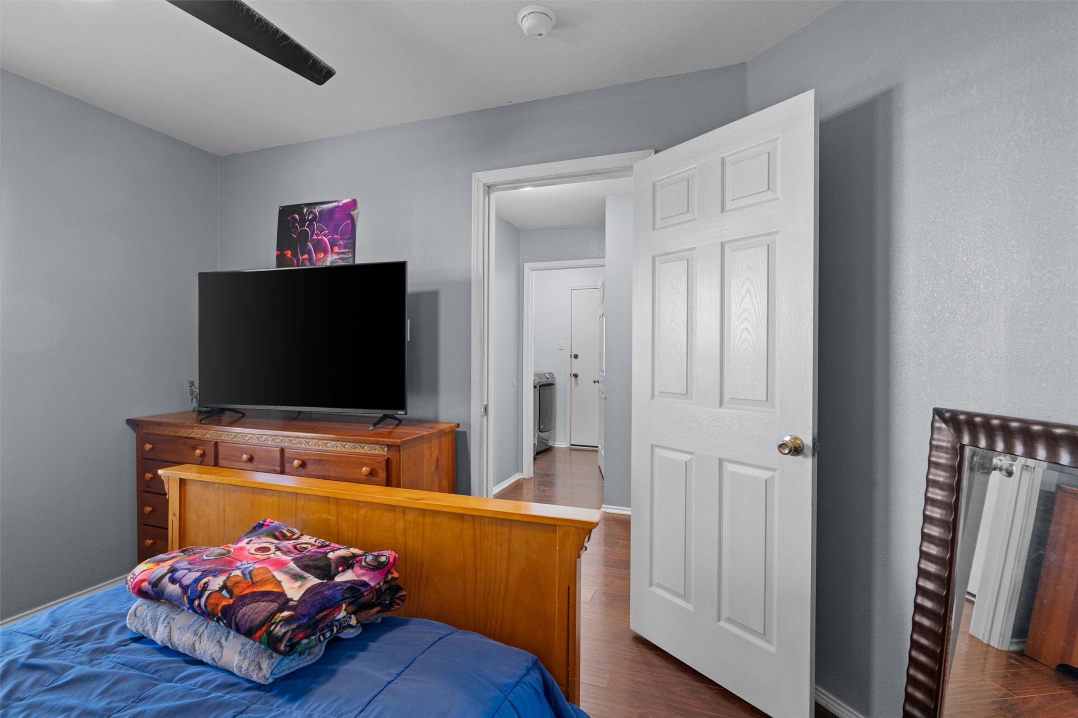128 Steven Street Hutto, TX 78634 - Photo 22 of 29 a living room with furniture and a flat screen tv