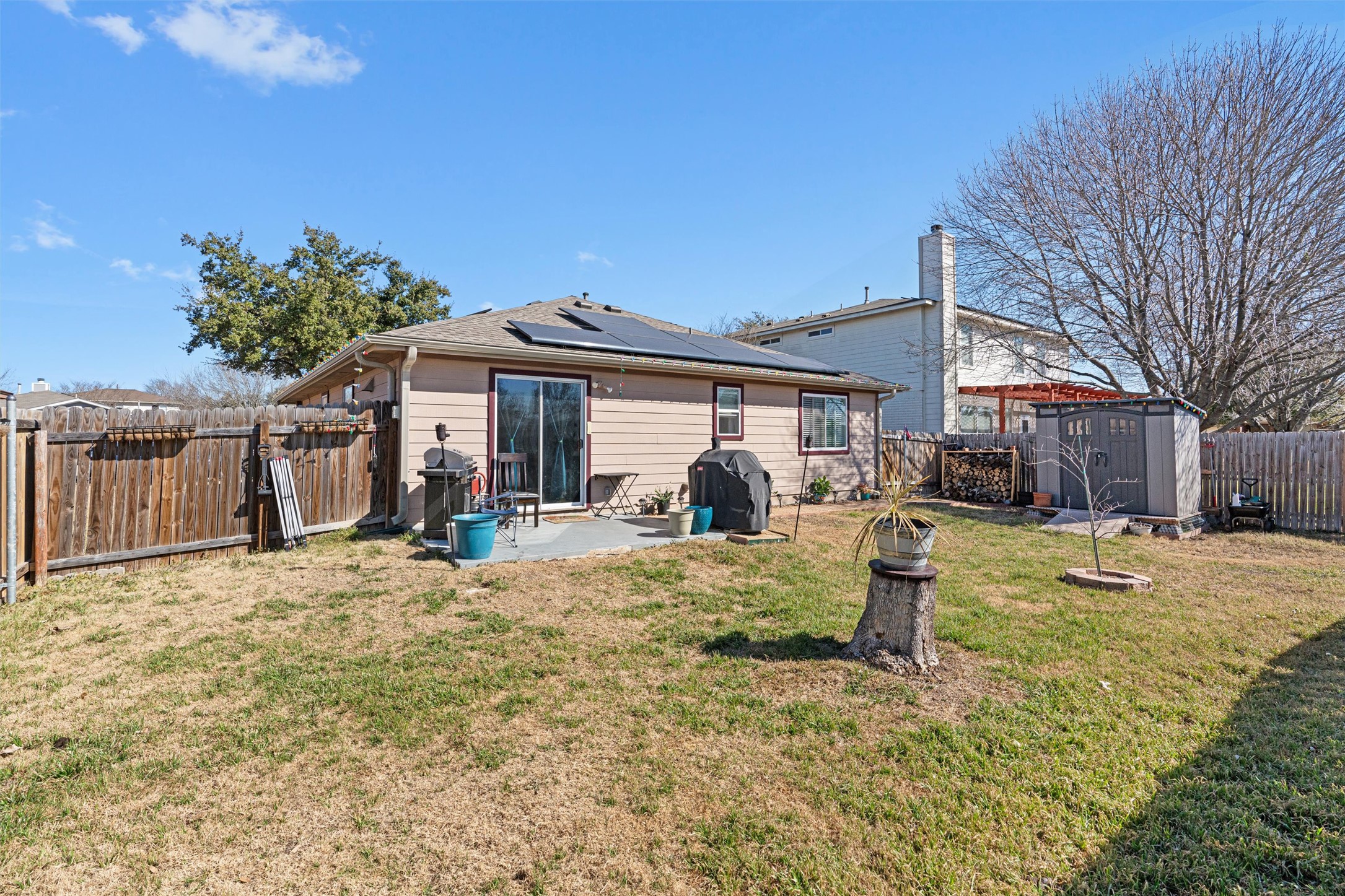 128 Steven Street Hutto, TX 78634 - Photo 27 of 29 a front view of a house with a yard covered with snow