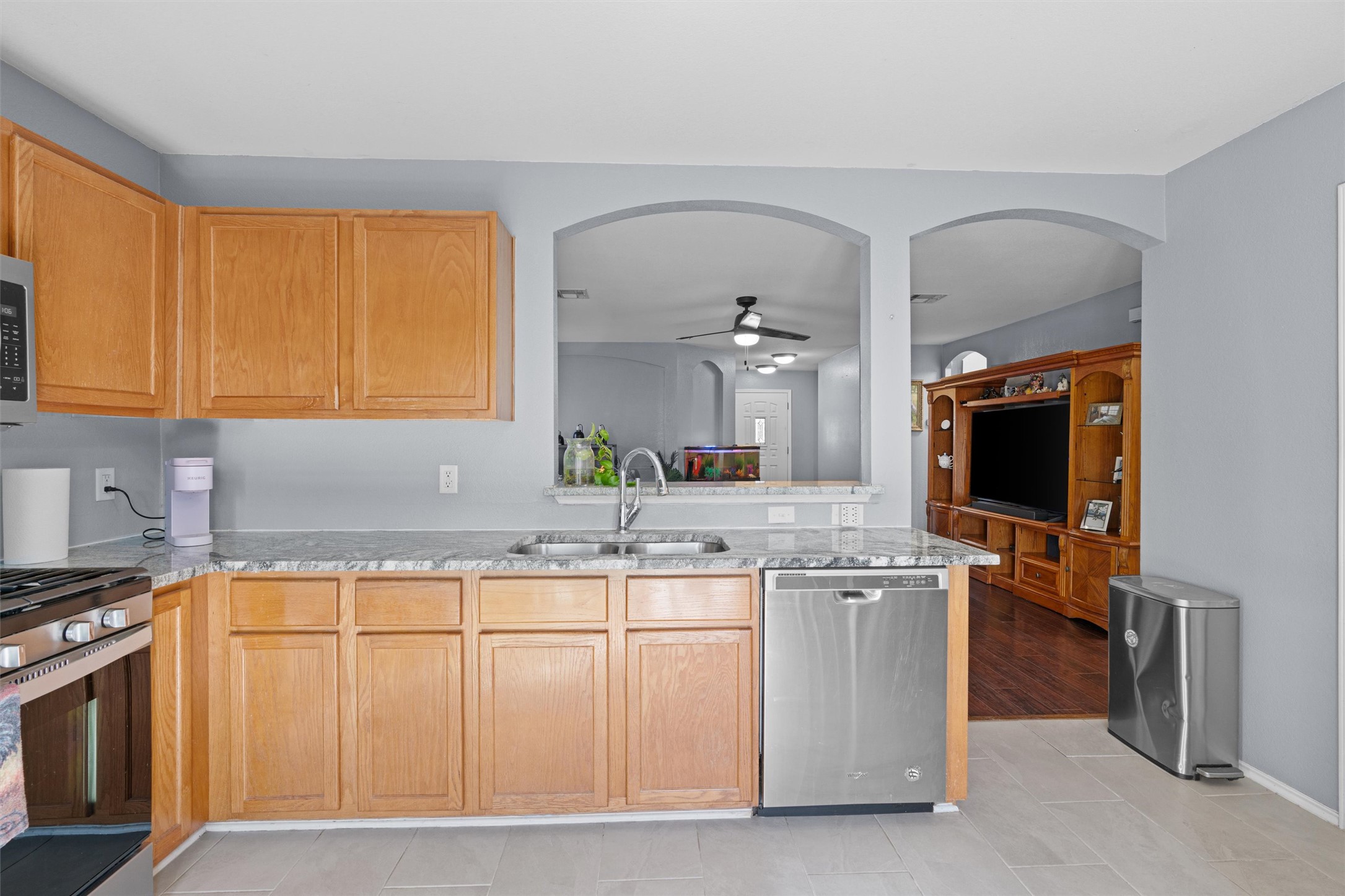 128 Steven Street Hutto, TX 78634 - Photo 9 of 29 a kitchen with stainless steel appliances granite countertop a stove and a sink